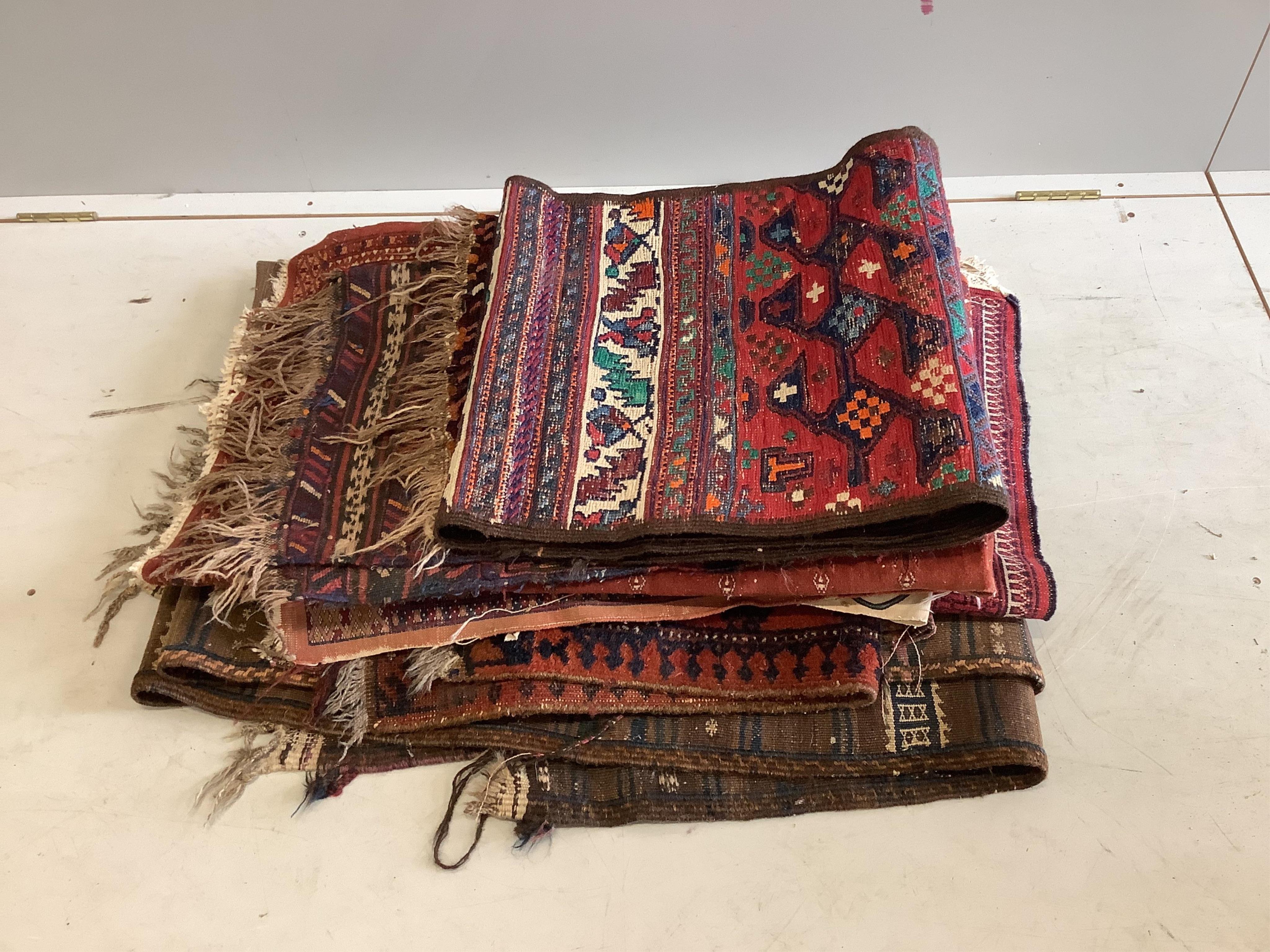 A quantity of assorted antique and later rugs and mats. Condition - poor to fair (a.f.)
